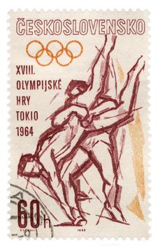 CZECHOSLOVAKIA - CIRCA 1963: A stamp printed in Czechoslovakia, shows wrestling, devoted to Olympics in Tokyo, series, circa 1963