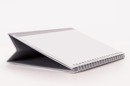 Blank desk calendar, isolated on white background.