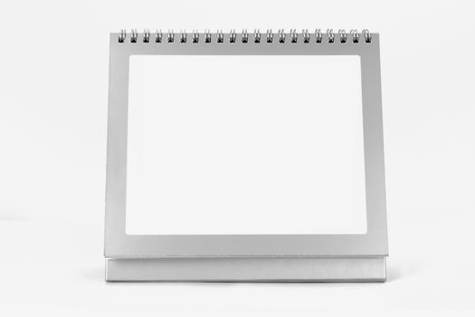 Blank standing desk calendar, front view, isolated on white background.