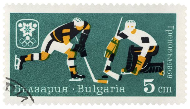 BULGARIA - CIRCA 1968: A post stamp printed in Bulgaria shows hockey players, dedicated to Winter Olympic games in Grenoble, series, circa 1968