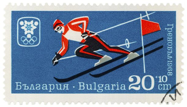 BULGARIA - CIRCA 1968: A post stamp printed in Bulgaria shows skier on a steep mountain slope, dedicated to the  Winter Olympic Games in Grenoble, series, circa 1968