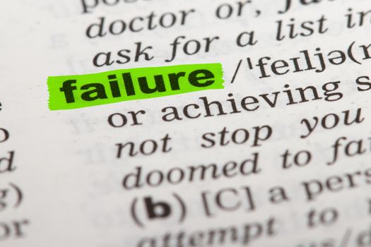 Failure word highlighted with green marker on dictionary page.