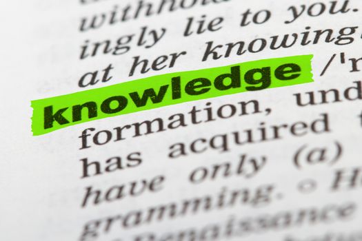 Knowledge word highlighted with green marker on dictionary page.