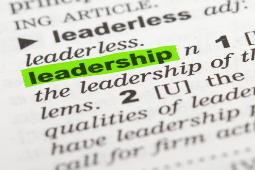 Leadership word highlighted with green marker on dictionary page.