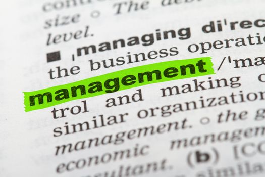 Management word highlighted with green marker on dictionary page.