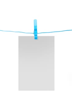 White, blank card on rope with blue, plastic clothespin, isolated on white background.