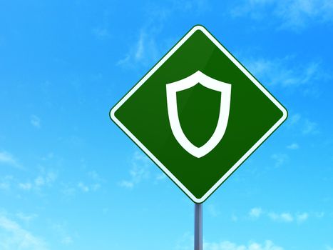 Safety concept: Contoured Shield on green road (highway) sign, clear blue sky background, 3d render