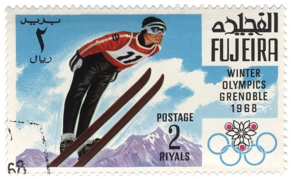 Fujeira - CIRCA 1968: A stamp printed in Fujeira shows ski jumper, devoted to the Winter Olympic Games in Grenoble, series, circa 1968