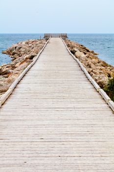 Long Wooden Dock with Observatory and Beautiful View of the Calm Ocean