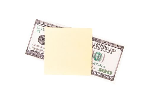 One hundred dollar bill with yellow, blank, empty sticky post it note for your message, isolated on white background.