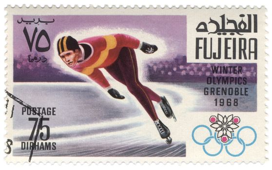 Fujeira - CIRCA 1968: A stamp printed in Fujeira shows running skater, devoted to the Winter Olympic Games in Grenoble, series, circa 1968