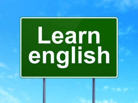 Education concept: Learn English on green road (highway) sign, clear blue sky background, 3d render