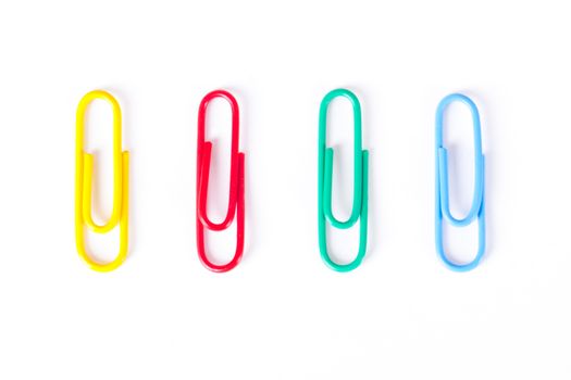 Multi colored paper clips, isolated on white background.