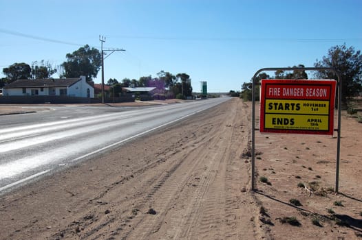 Road fire safety sign on highway in outback, Australia