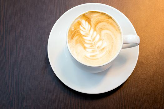 Cup of latte coffee with Christms tree symbol