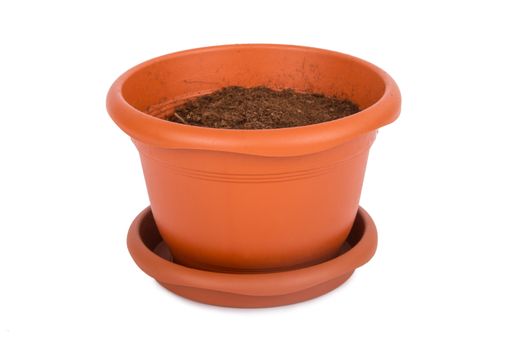 Flower pot with full of soil, isolated on white background.