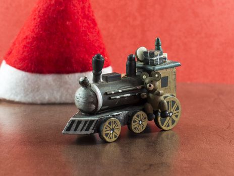 old wooden train with presents and teddy for christmas
