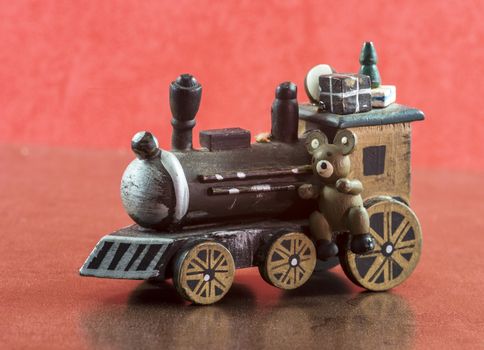 old wooden train with presents and teddy for christmas