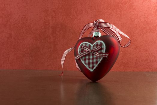 red christmas heart on red and golden background