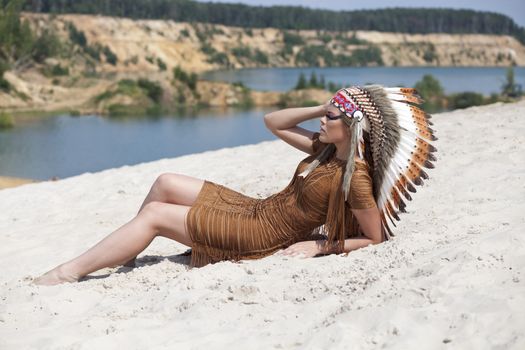 Young woman in costume of American Indian