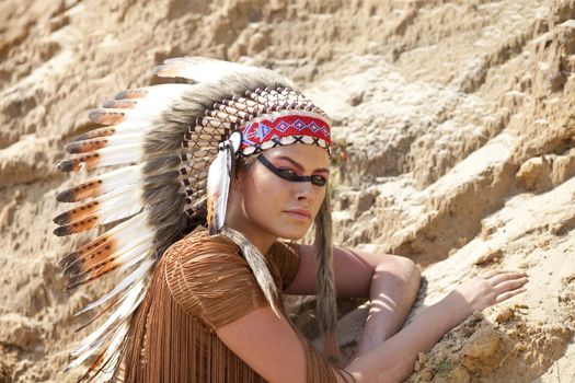 Young woman in costume of American Indian