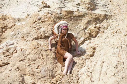 Young woman in costume of American Indian