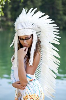 Young woman in costume of American Indian