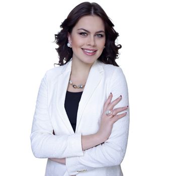 Young business woman standing against white background