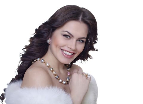Portrait of attractive brunette in a fur coat