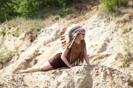 Young woman in costume of American Indian