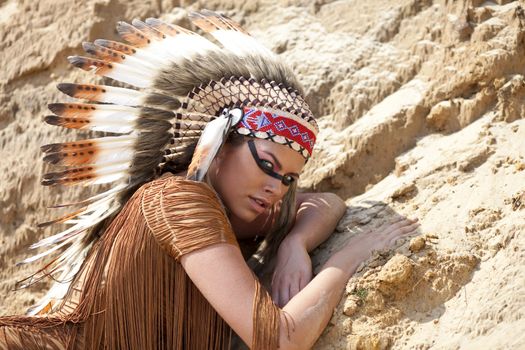 Young woman in costume of American Indian