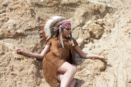 Young woman in costume of American Indian