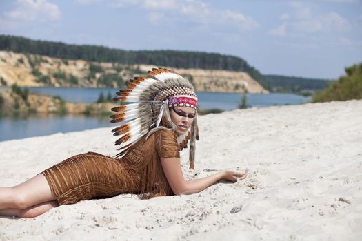 Young woman in costume of American Indian