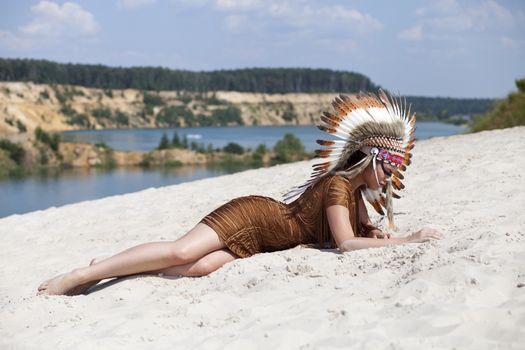 Young woman in costume of American Indian