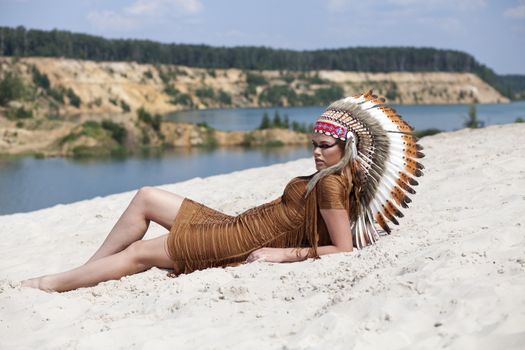 Young woman in costume of American Indian