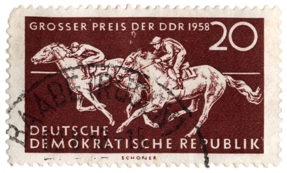 GDR - CIRCA 1958: stamp printed in GDR (East Germany), shows equestrian sport (galloping riders), circa 1958
