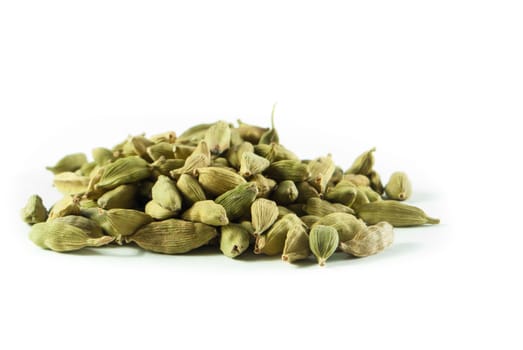 Pile of whole cardamom on white background
