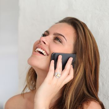 Young beautiful woman talking on cell phone