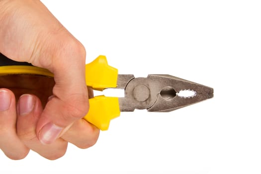 Hand holding yellow pliers, isolated on white background.