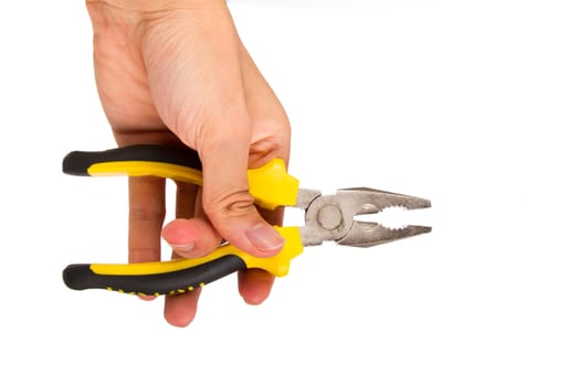 Hand holding yellow pliers, isolated on white background.