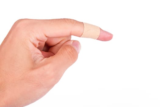 Adhesive bandage, plaster on index finger, isolated on white background.