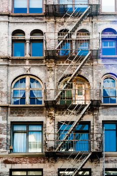 Fire ladder at old beautiful house downtown in New York