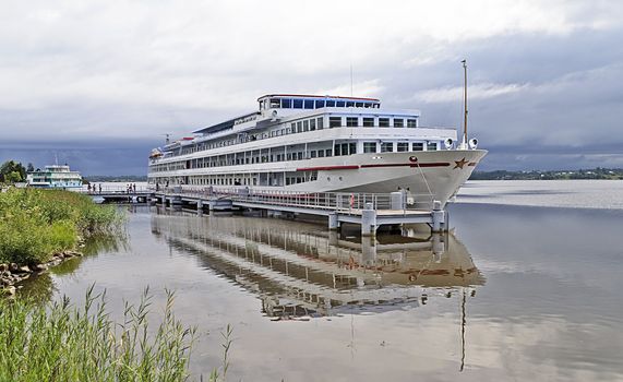 Tourist boat at the pier. The village of Gorica on the river Sheksna, Vologda Region, north Russia