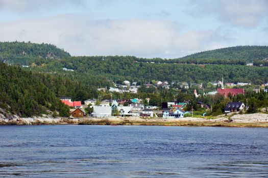 View of small town, Tadoussac, Quebec Canada from the Saguenay river