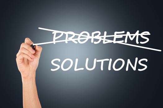 Hand crossing problems and writing solutions on dark background.