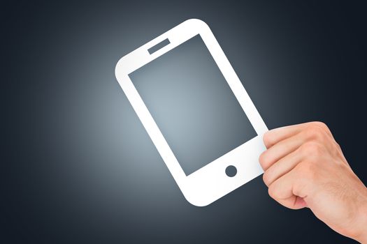 Hand holding white, empty, blank mobile phone cardboard on dark background.