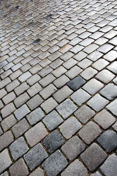 Old and wet cobblestoned street in Nuremberg, Germany.