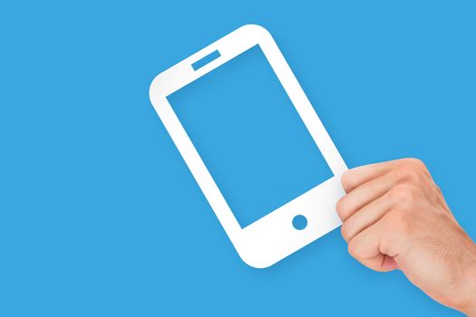 Hand holding white, empty, blank mobile phone cardboard, isolated on blue background.