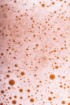Close up view of beer foam, top view.