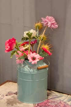 mix plastic flowers in  vase , decor for table